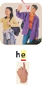 Photograph of a boy with the word “he” below. A finger points to the “e” in “he.”