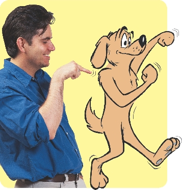 photograph of a man pointing to a cartoon illustration of a dog